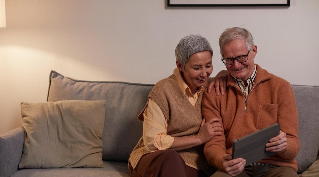 A couple on a tablet reading about the importance of diet and nutrition